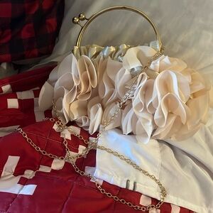Ruffled purse with handle or strap.